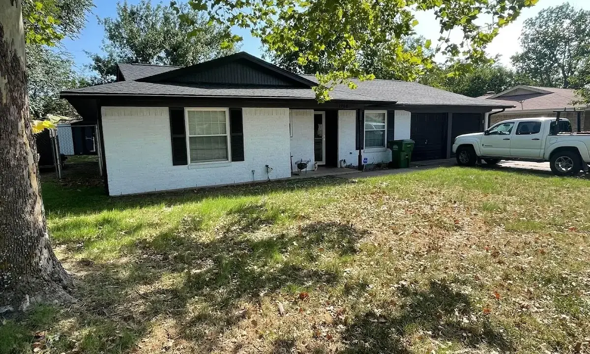 Professional roofing crew working on a residential roof in Cheyenne